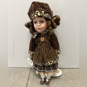 Collectible doll on stand